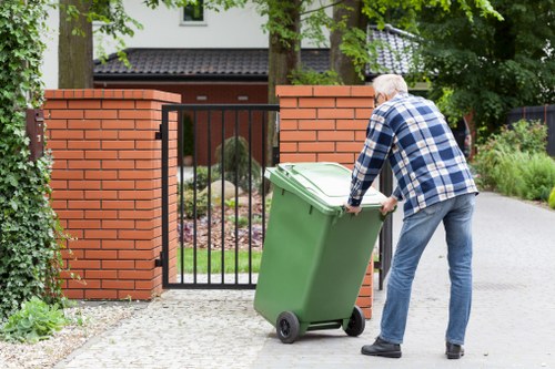 Company van and operatives starting a commercial waste collection